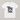 A white short-sleeve crewneck t-shirt with the words 'Big Sis.' printed in a large black serif font on the front, displayed flat against a neutral light gray background.
