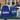 Blue drawstring bag, lunch bag with dinosaur patterns, and tumbler with 'GEORGE' on a table outdoors.