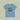 Blue t-shirt with 'Wild and THREE' text on a beige background