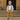 Boy wearing smart suit with suspenders and bow tie