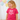 Child wearing a pink 'BIG Sister' shirt with colorful balloons in the background