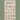 Calico Countdown to Christmas advent calendar with 24 numbered pockets hanging from a wooden dowel on a green background