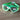 Green and white goggles with UV Shield Anti-Fog label on a wooden surface