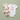 White baby onesie with 'new to the crew' text and a pink stuffed bunny on a light green background