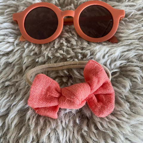 Orange sunglasses and bow