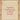 Beige drawstring bag with red text 'A Sprinkle of Christmas Magic for the 1st December' on a wooden surface.