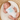 Newborn baby sleeping in a basket wearing a white onesie with 'new to the crew' text.