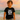 Young boy wearing a black Big Bro sunglasses t-shirt, standing outdoors and smiling – cool big brother tee for sibling announcements and kids’ fashion