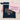 Navy blue pouch with 'Baby' and footprints, pink shirt with 'I've got a secret' text, on beige background